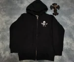 The Chrome Hearts Foti Skeleton Circle Logo Zip Up Hoodie is a limited edition item from the high-end fashion brand Chrome Hearts. It features the Chrome Hearts Foti skeleton circle logo on the front and a zip-up front. This hoodie is made of black cotton and is no longer in production, making it rare and potentially difficult to find. It may be available on resale sites or through private collectors. Chrome Hearts is known for its luxury jewelry and accessories, as well as its clothing line. Its items are highly sought after by collectors and fashion enthusiasts.